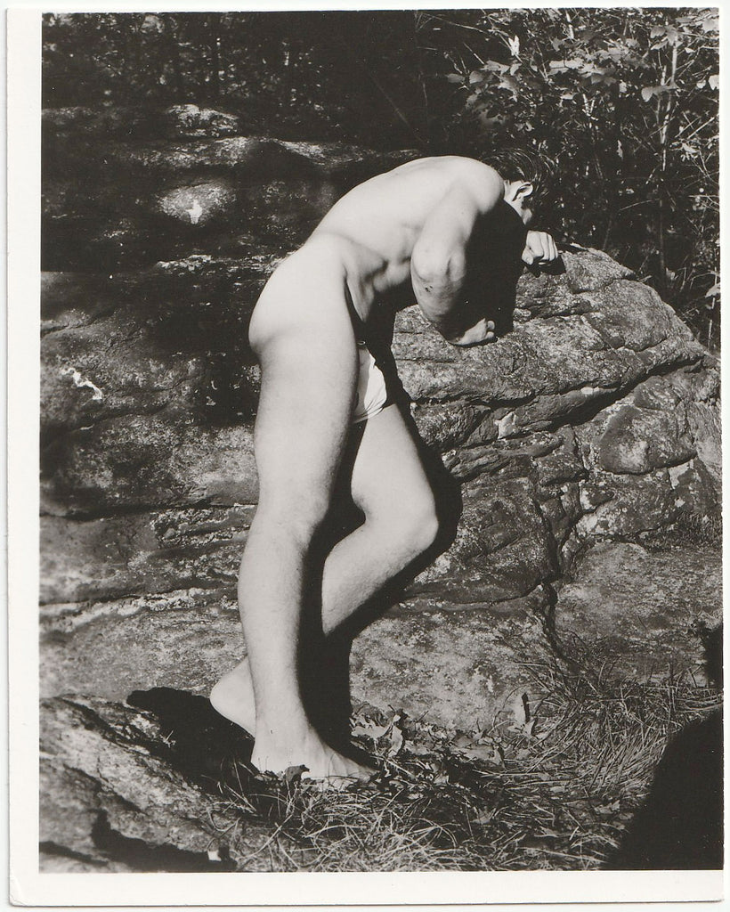 Distraught Bodybuilder on Boulder, vintage gay physique photo.