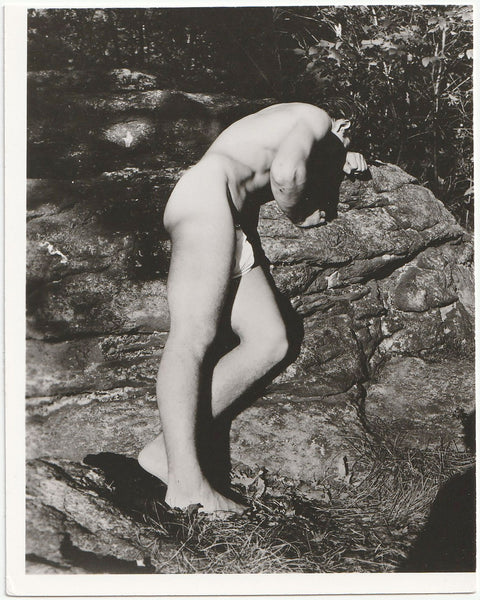 Distraught Bodybuilder on Boulder, vintage gay physique photo.