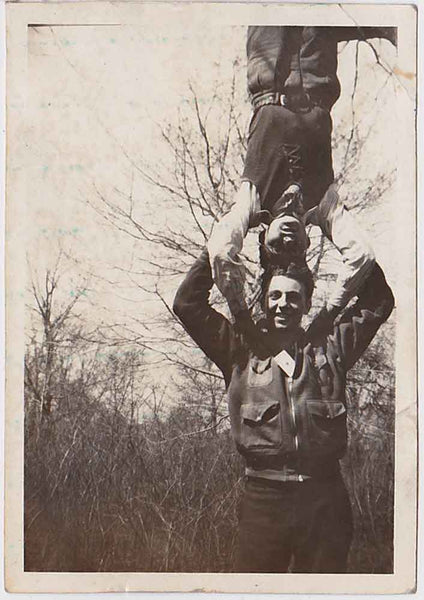vintage snapshot Two guys practice their head stand.