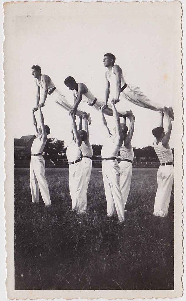 Vintage snapshot A team of nine hand balancers in formation. Probably French.
