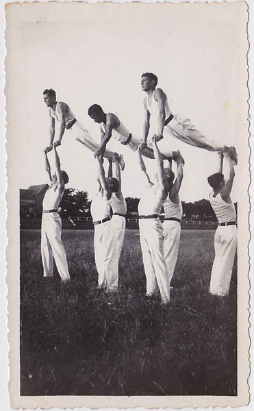Vintage snapshot A team of nine hand balancers in formation. Probably French.