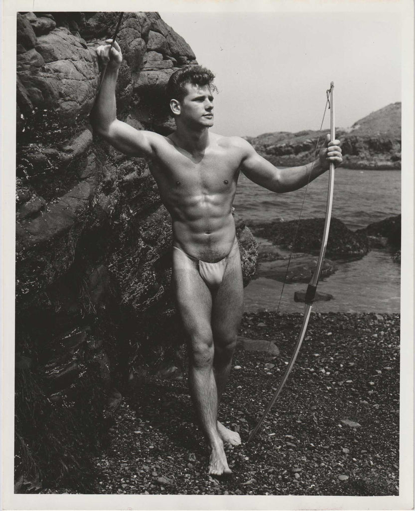 vintage gay photo of handsome Joe Survilas standing on a beach