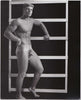 Vintage physique photo of handsome Kip Behar standing in the studio.