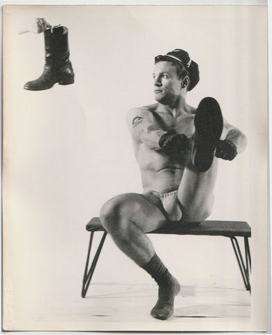 Original vintage photo of "Young Savage in Leather... posed to display his rugged virility," by Chuck Renslow - Kris Studio, Chicago.
