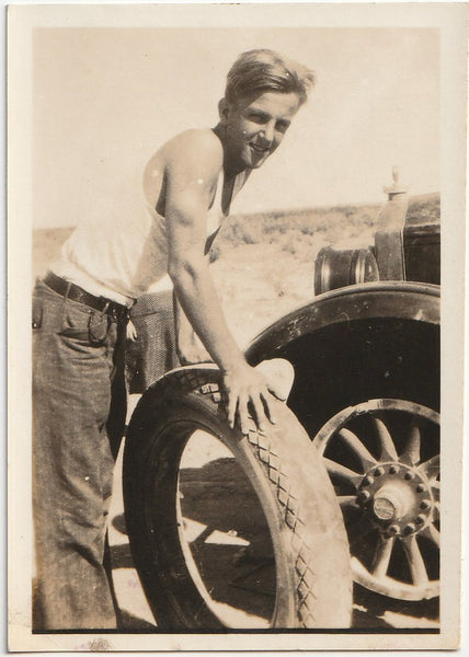 Vintage photo Cute Guy Changing Tire