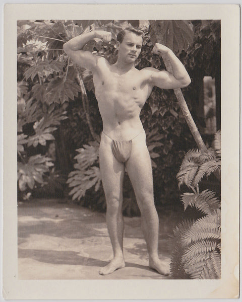 man-in-posing-strap-flexing-biceps vintage physique photo