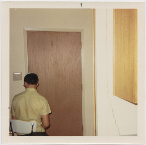 Seated Man Facing Door vintage color photo