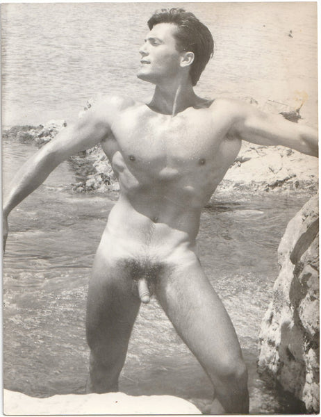 Vintage gay physique photo Handsome Manu strikes a striking pose. Possibly by Barrington.