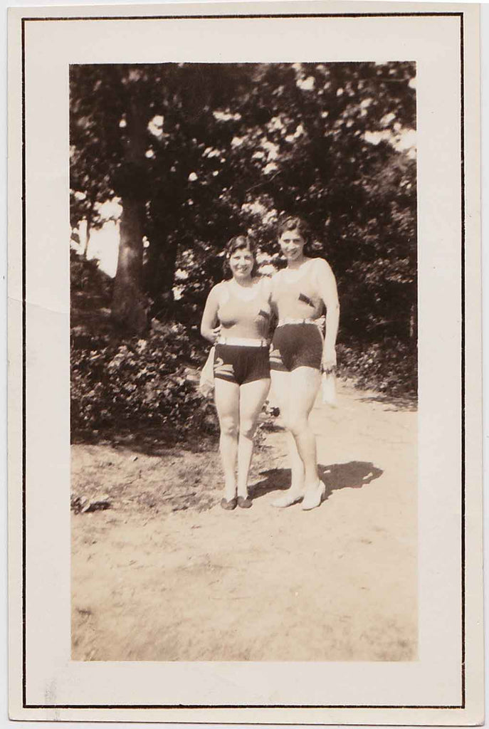 Vintage snapshot of two young women in swimsuits.