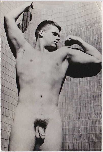 Male nude Standing before a matchstick backdrop, vintage gay photo