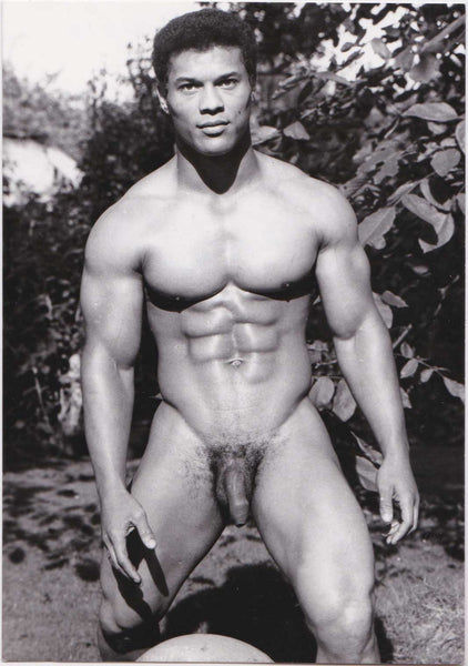 Vintage photo of handsome and muscular Mr. Universe 1964, Rick Wayne in the garden.