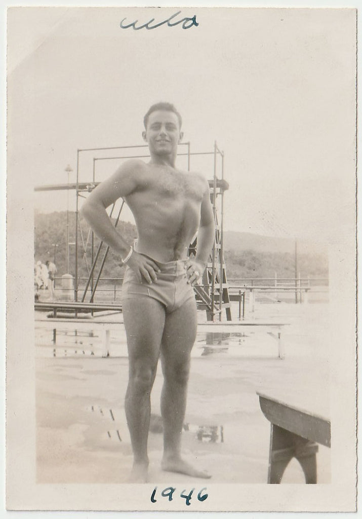 Handsome studly guy sucking in his abs and puffing out his chest. Handwritten on verso: "A guy I knew, Sept 14, 1946, Cuba." 