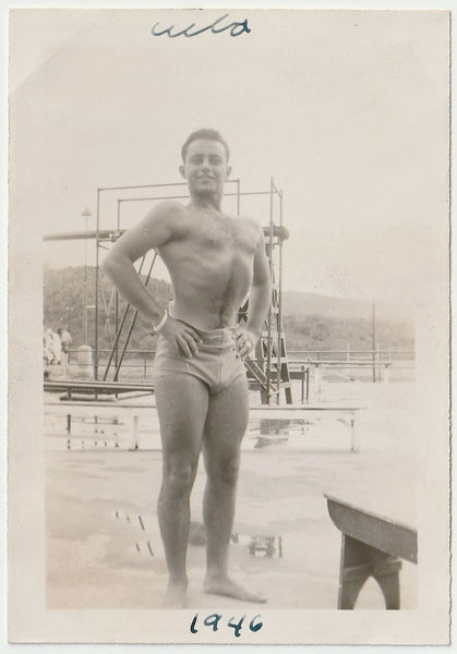 Handsome studly guy sucking in his abs and puffing out his chest. Handwritten on verso: "A guy I knew, Sept 14, 1946, Cuba." 