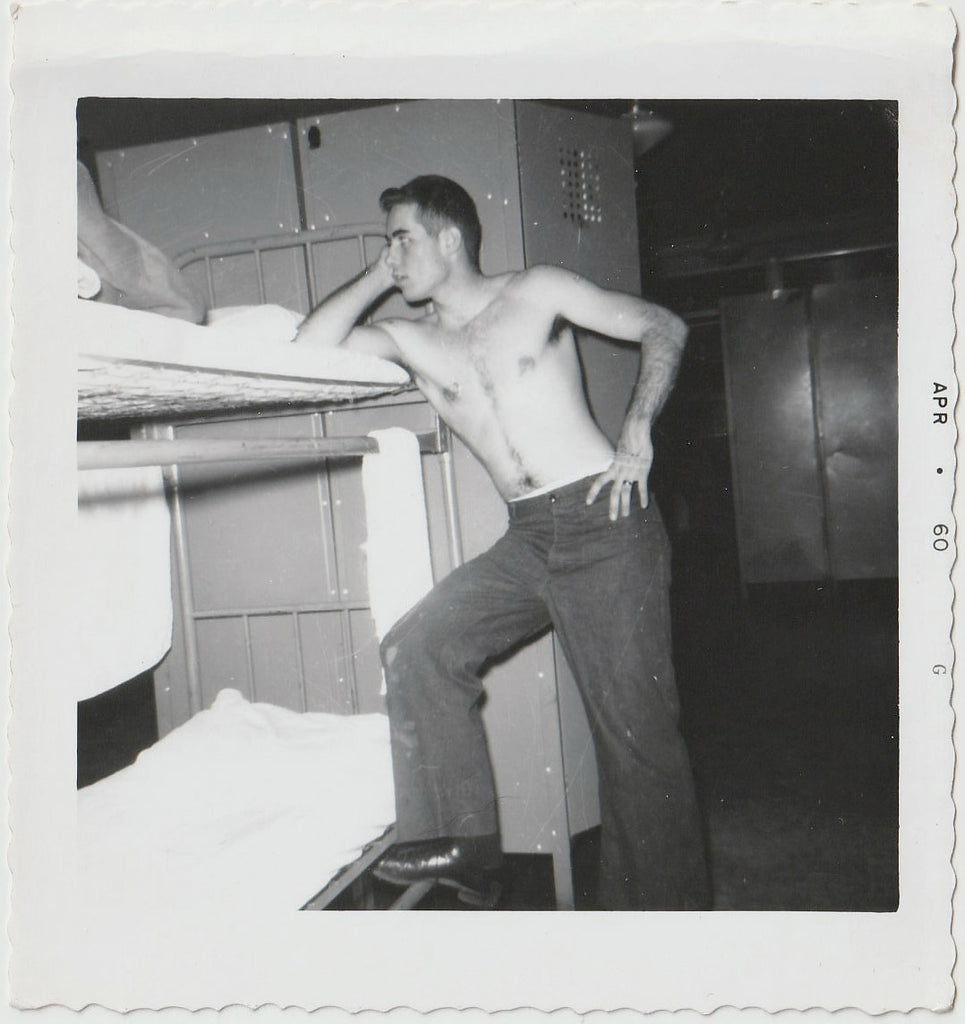 Shirtless Soldier Leaning on Bunk Beds