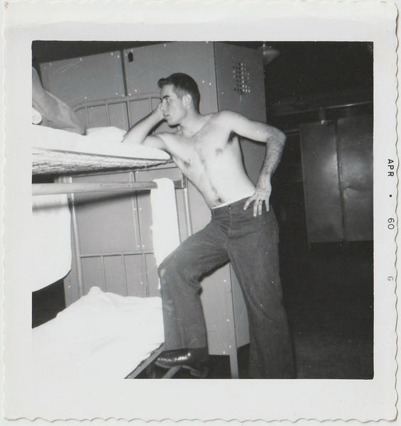 Shirtless Soldier Leaning on Bunk Beds