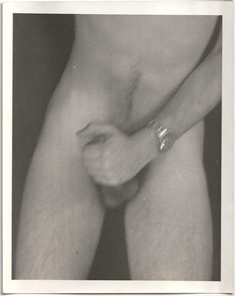 Slightly blurry hand job suggests motion vintage gay erotic photograph