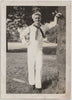 Vintage black and white photo of a man in a sailor outfit standing next to a tree, identified on verso as Harry Zavik, dated August 20, 1941.