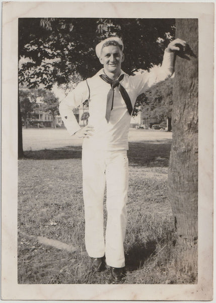 Vintage black and white photo of a man in a sailor outfit standing next to a tree, identified on verso as Harry Zavik, dated August 20, 1941.
