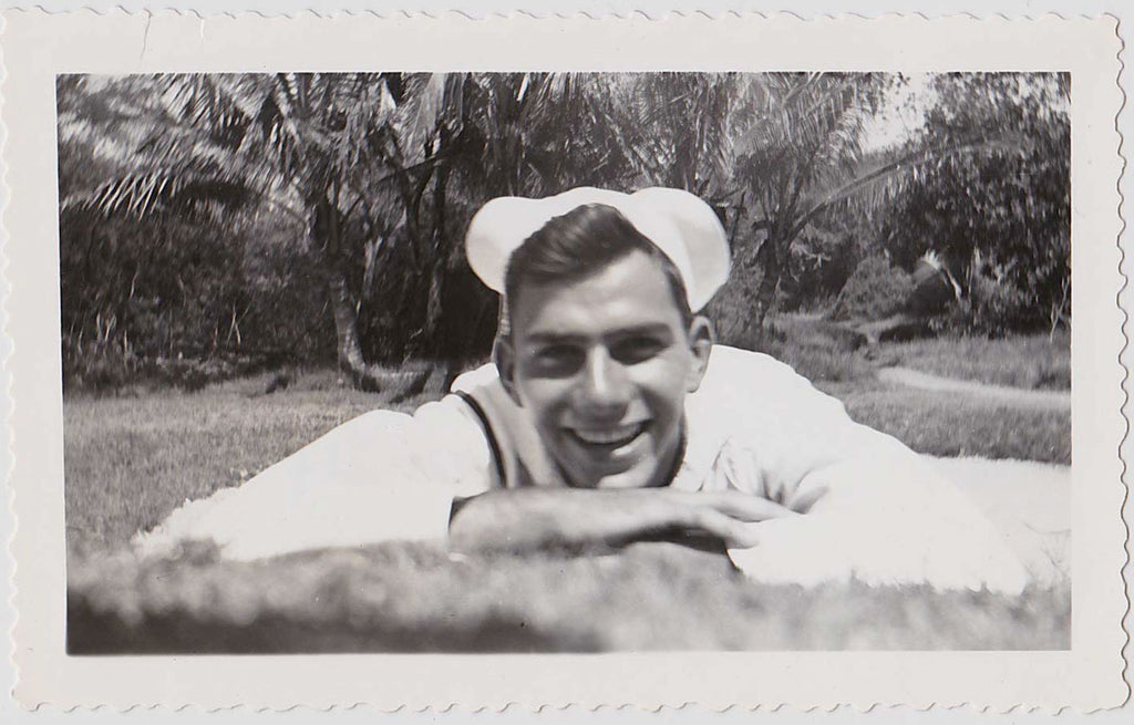Worm's eye view of a handsome smiling sailor vintage gay snapshot