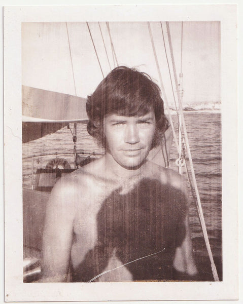 Handsome Guy in Sailboat vintage Polaroid