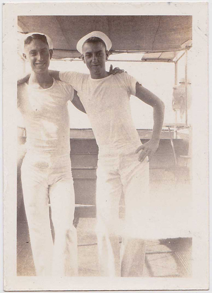 Cute couple of affectionate sailors in their tight white t-shirts and pants. Vintage gay snapshot.