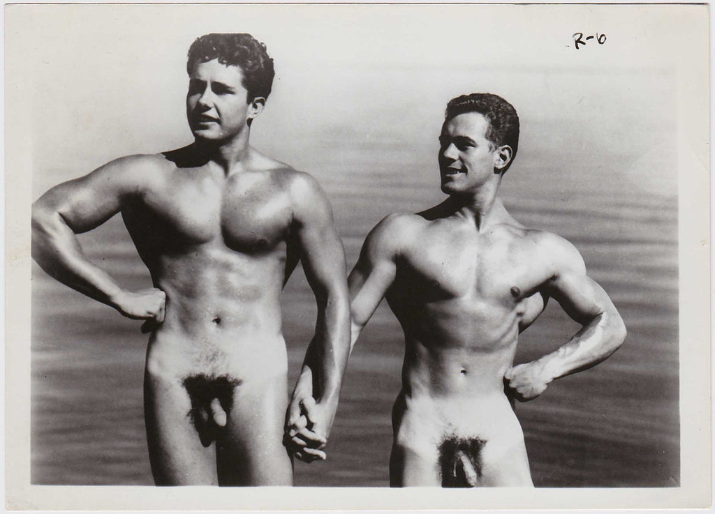 Muscle duo holding hands. On the right is Mike Sill, with Walt Needham on the left. 
