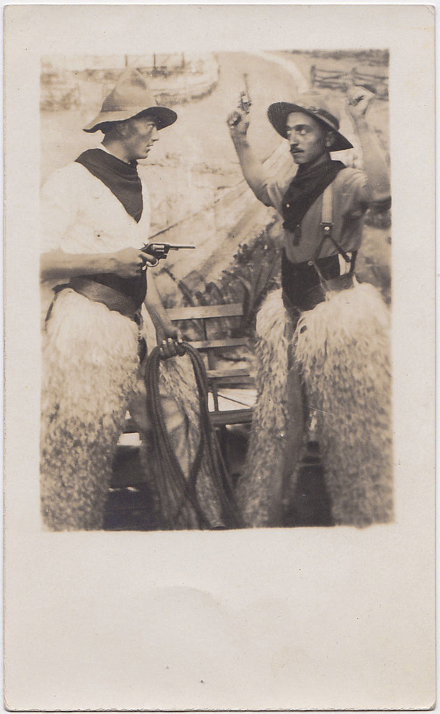 A dramatic hold up in the Old West and it looks like somebody's about to get hog-tied! 3 1/4” x 5 1/2" vintage Real Photo Postcard. Very good condition. 1913.