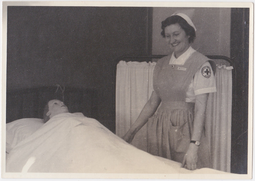 Nurse by Her Patient's Bedside