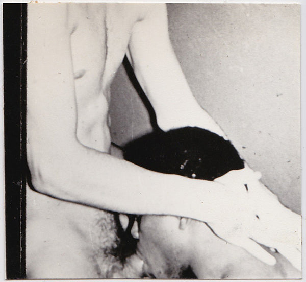 Vintage gay photo of a two men having oral sex.