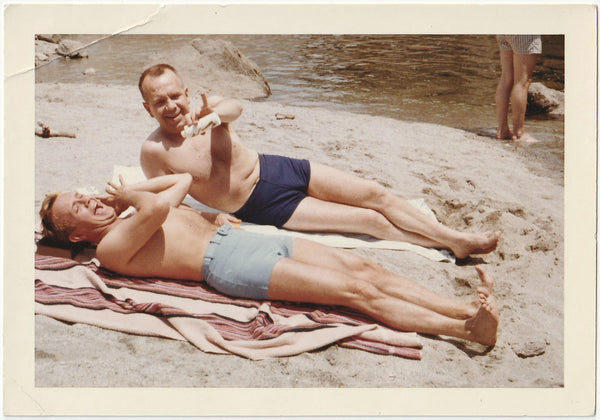 Two Playful Men in Swimsuits vintage color photo June 1960.