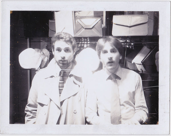 Two Men at Handbag Display vintage Polaroid