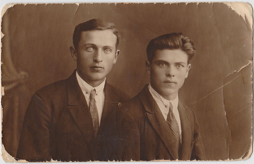 Two handsome young Russian guys, one of whom has stunning eyes.  Vintage sepia studio photo on postcard paper, matt finish. 3 3/8" x 5  1/4," dated on verso 1930. 
