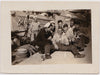 Six good looking sailors surround their clearly inebriated buddy seated on the dock vintage photo