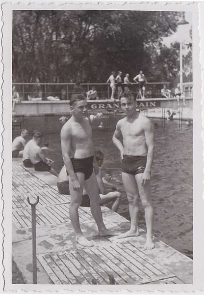 Set of two vintage snapshots. Handsome young guys pose amidst a world of men at the Grand Bain.