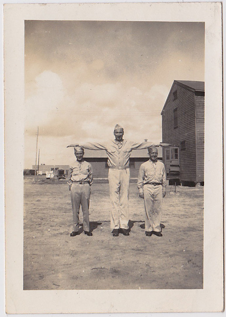 Tall and two short soldiers in a row vintage snapshot