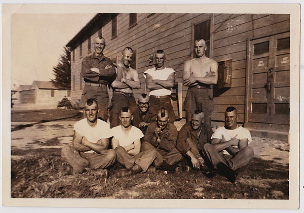 Ten soldiers outside their barracks proudly displaying their Mohawks Vintage snapshot