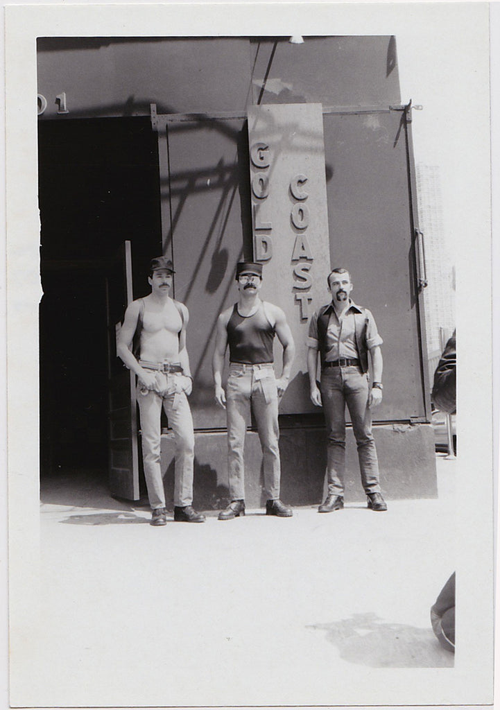 Three macho men stand outside the Gold Coast bar in Chicago, vintage photo