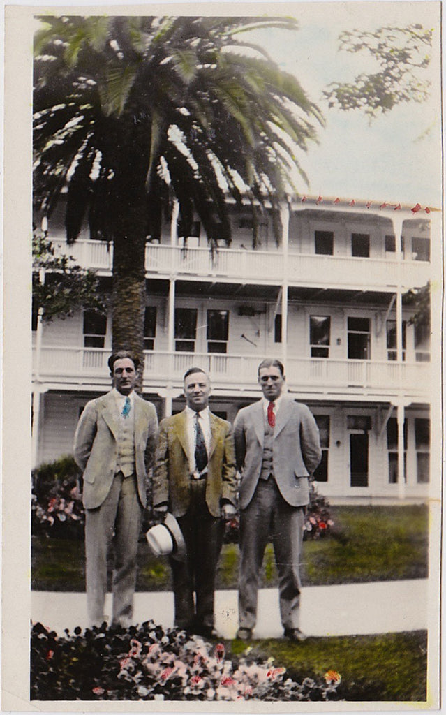 Three men standing in the gardens at the Coronado Hotel, San Diego vintage hand-colored snapshot