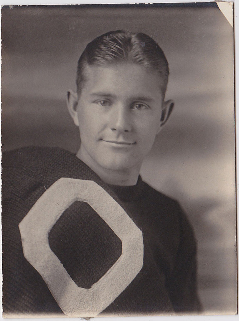 Athlete holding letter sweater vintage photo