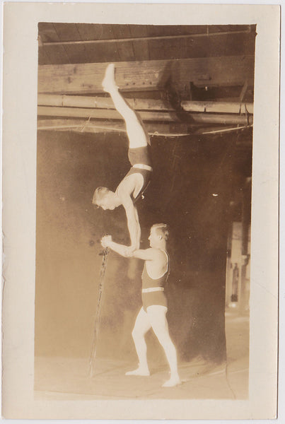 Vintage Sepia Photo: Two Acrobats Practicing