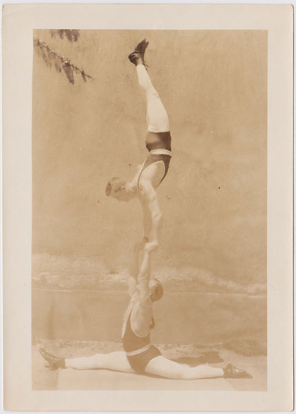 Vintage Sepia Photo: Two Acrobats Practicing