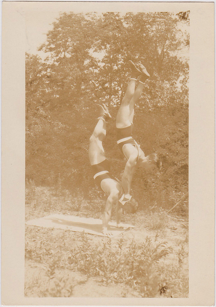 Vintage Sepia Photo: Two Acrobats Balancing