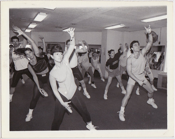 Group of good looking men and women in an aerobics class vintage photo