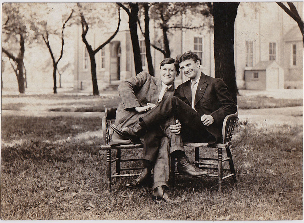 This couple of men entangle their legs and arms. Vintage real photo postcard c. 1920.