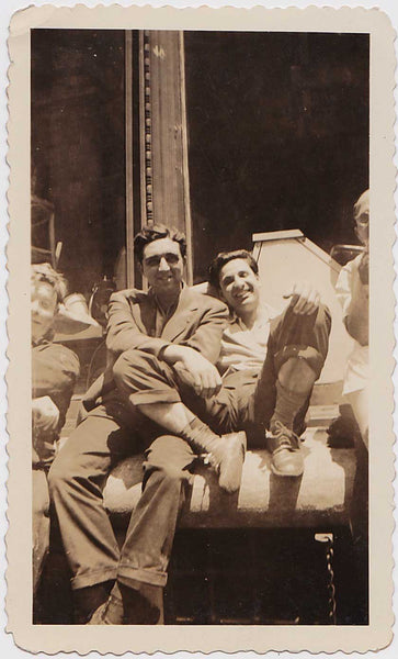 charming image of two affectionate men. Vintage sepia snapshot