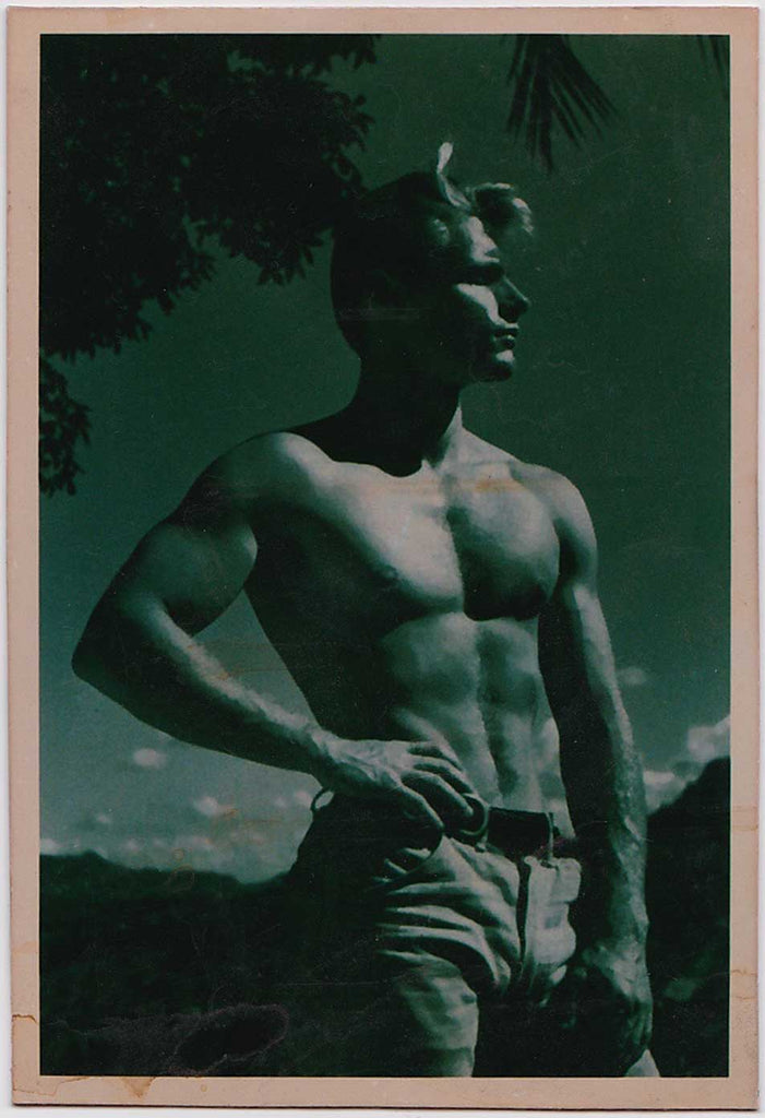 Vintage gay photo Handsome shirtless guy poses outdoors with one hand on his hip