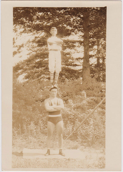 Vintage Photo: Boy Standing on Acrobat's Head