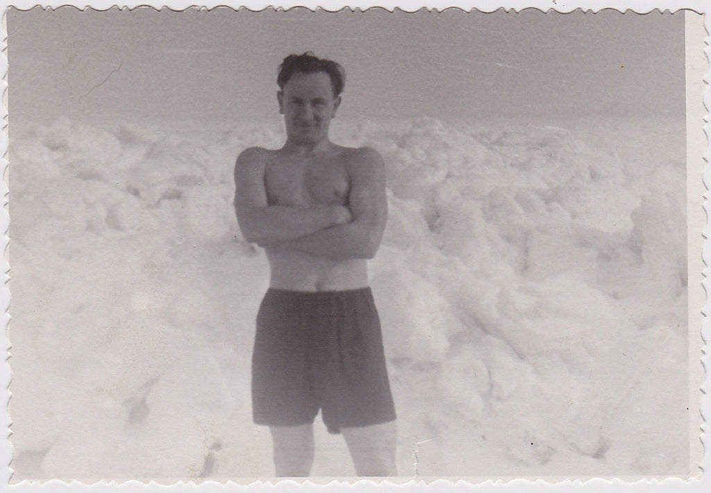 Vintage black and white photo Man Standing in his underwear in Arctic landscape