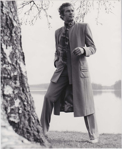 Vintage Men's Fashion photo c. 1972.  Designer: Gloria Gross, London.  Suit and matching collarless overcoat in a greige double jersey twill of 100% Dacron