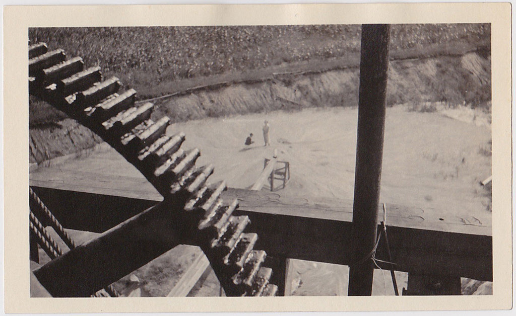 Giant Gear, Tiny People vintage industrial landscape photo